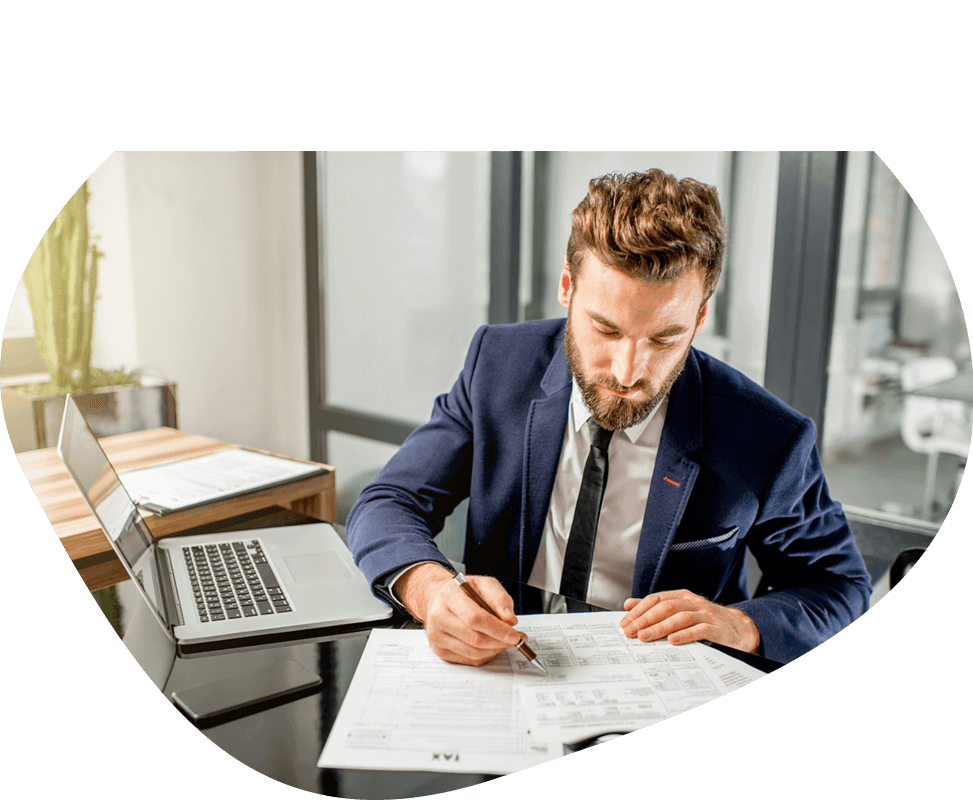 masked young business man working on papers